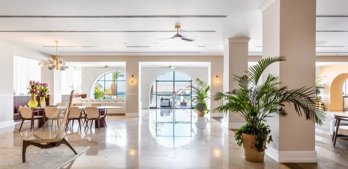 The lobby opens through stone.