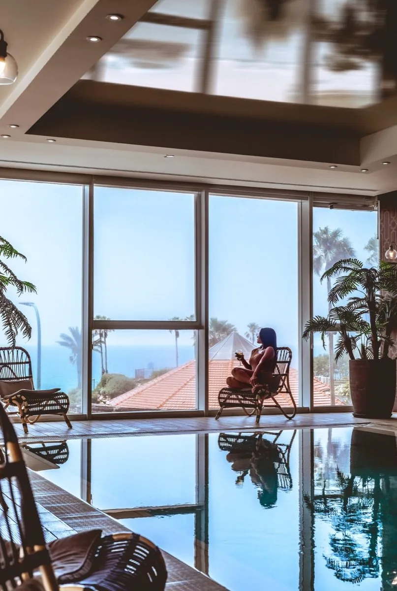 The pool looks out at the coast.
