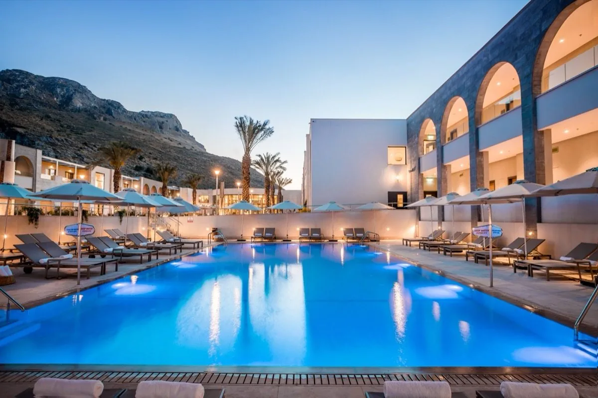 The pool keeps the sky's last blue.