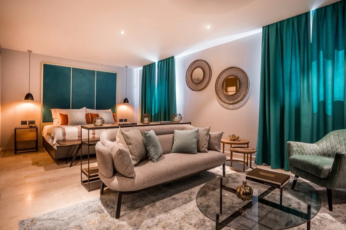 A suite in teal — the property's second register.