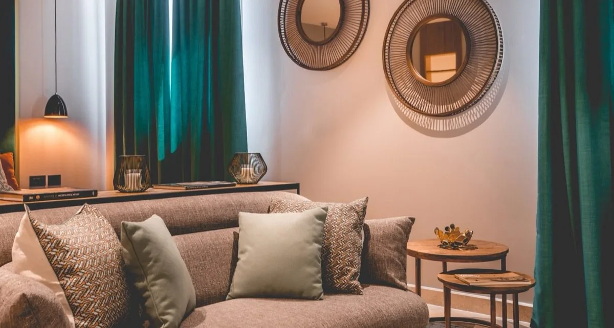 Twin mirrors, a lamp, teal.